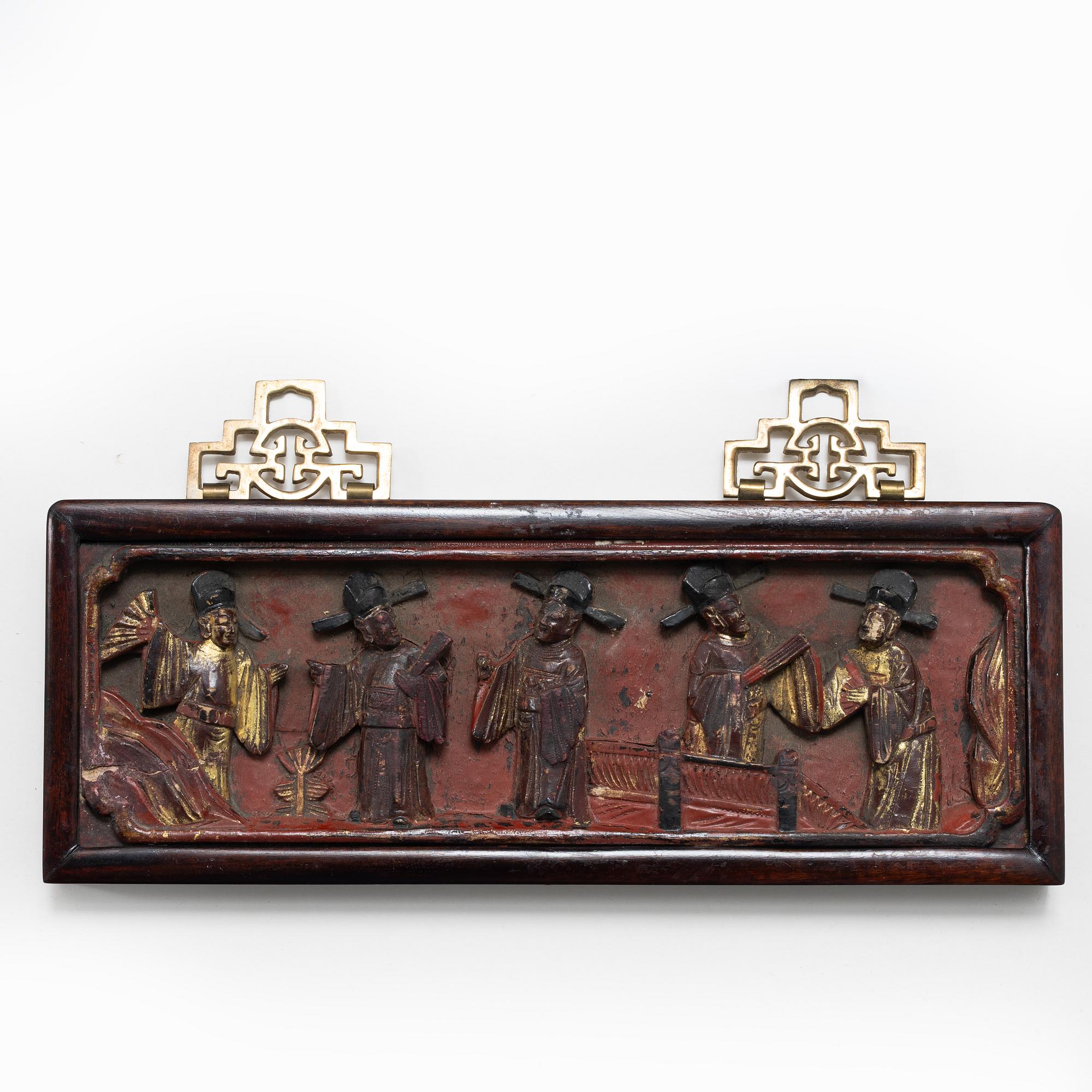 Three Chinese lacquer and wooden panels, two silk embroideries, first half of the 20th century.