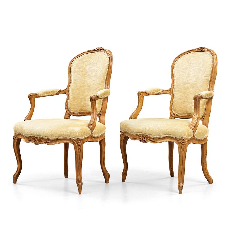 Two matched Louis XV 18th century armchairs.