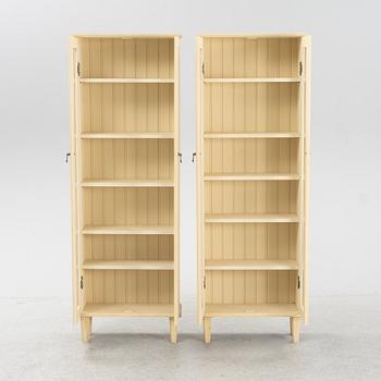 A pair of Gustavian style book cabinets, 21st century.