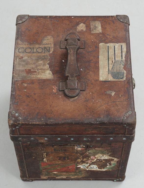 A early 20th cent brown leather trunk by Louis Vuitton.