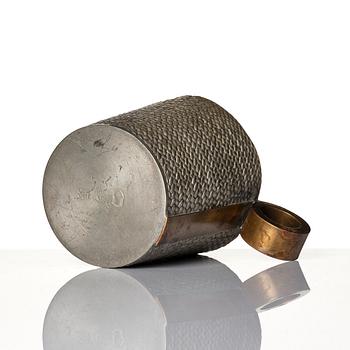 Björn Trägårdh, a pewter and brass mug, model "A 2272", Firma Svenskt Tenn, Stockholm 1936.