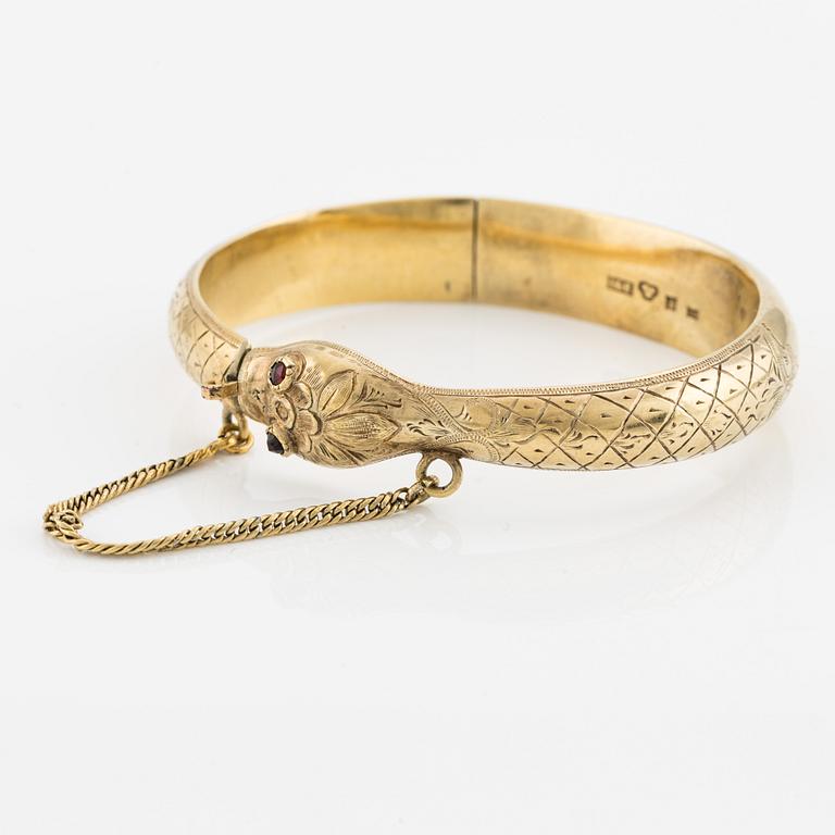 Bangle in the shape of a snake, 18K gold with garnets as eyes, Johan Gustaf Kihlberg, Nyköping 1863.