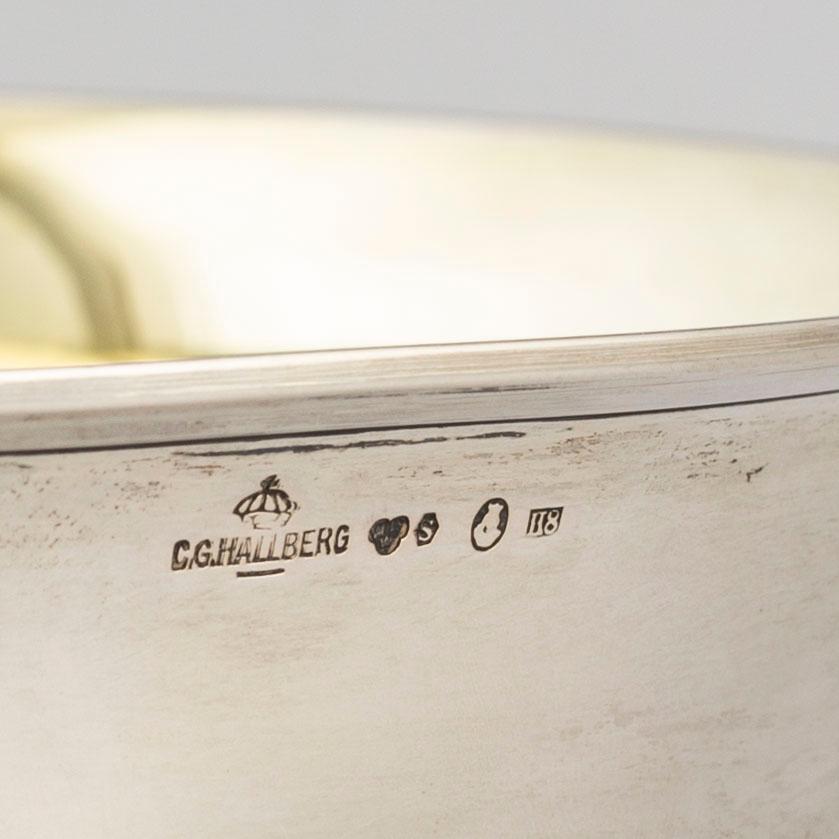 A parcel gilt silver bowl on a wooden base by CG Hallberg Stockholm 1934.