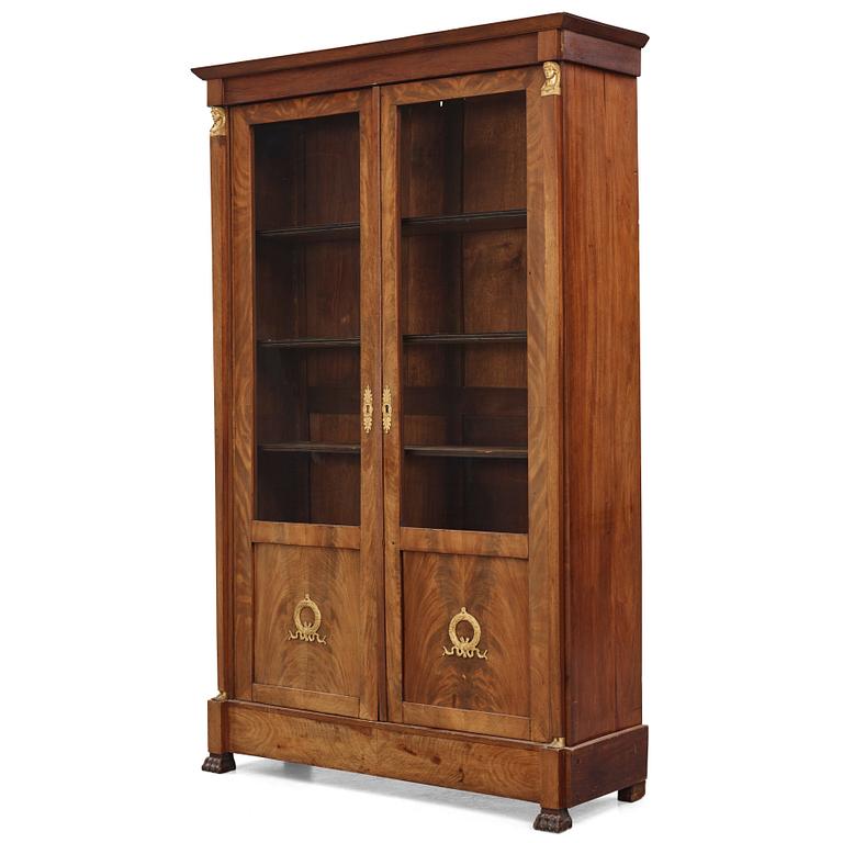 A French Empire mahogany and gilt-bronze mounted bibliothèque, early 19th century.