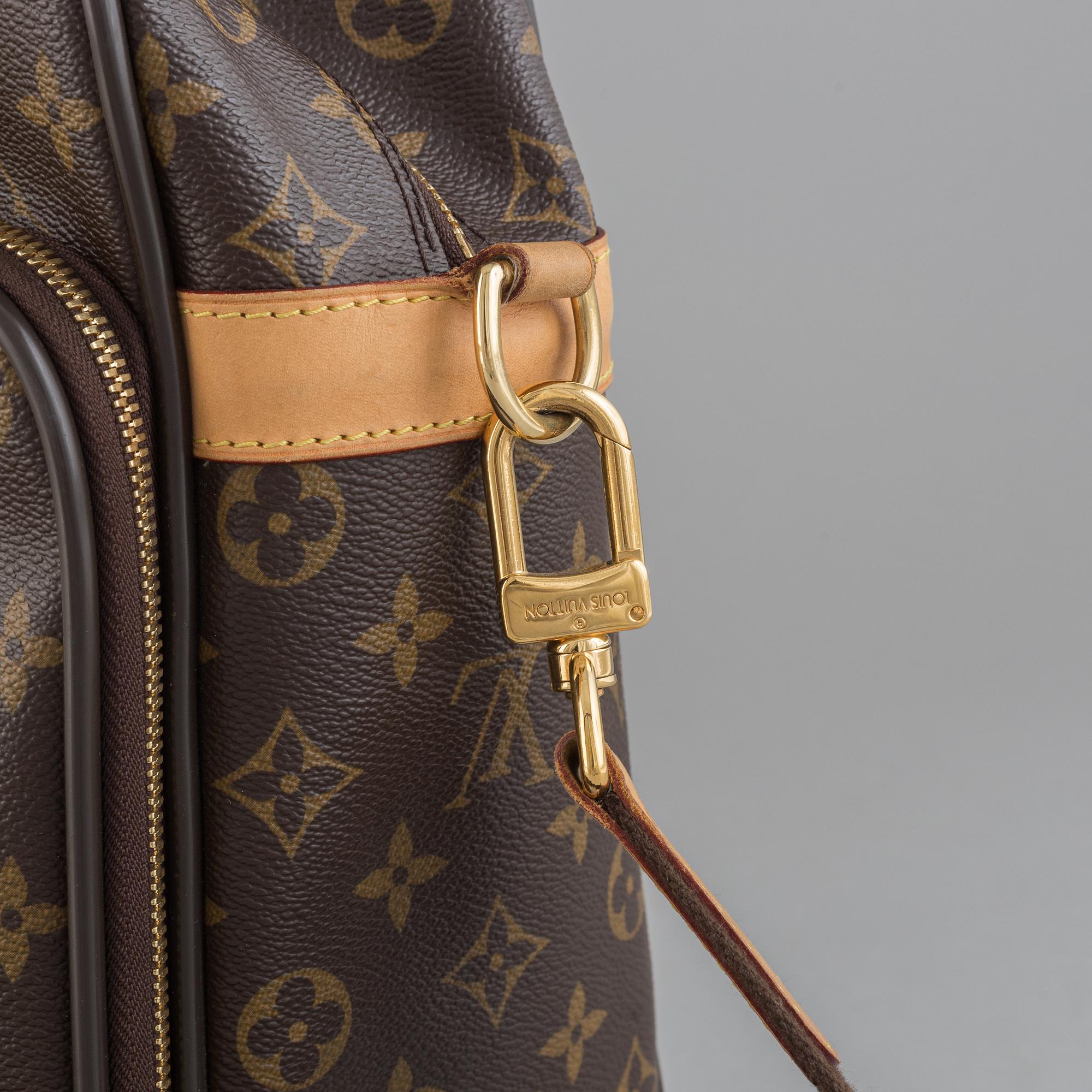 Louis Vuitton, a monogram canvas carry on bag.