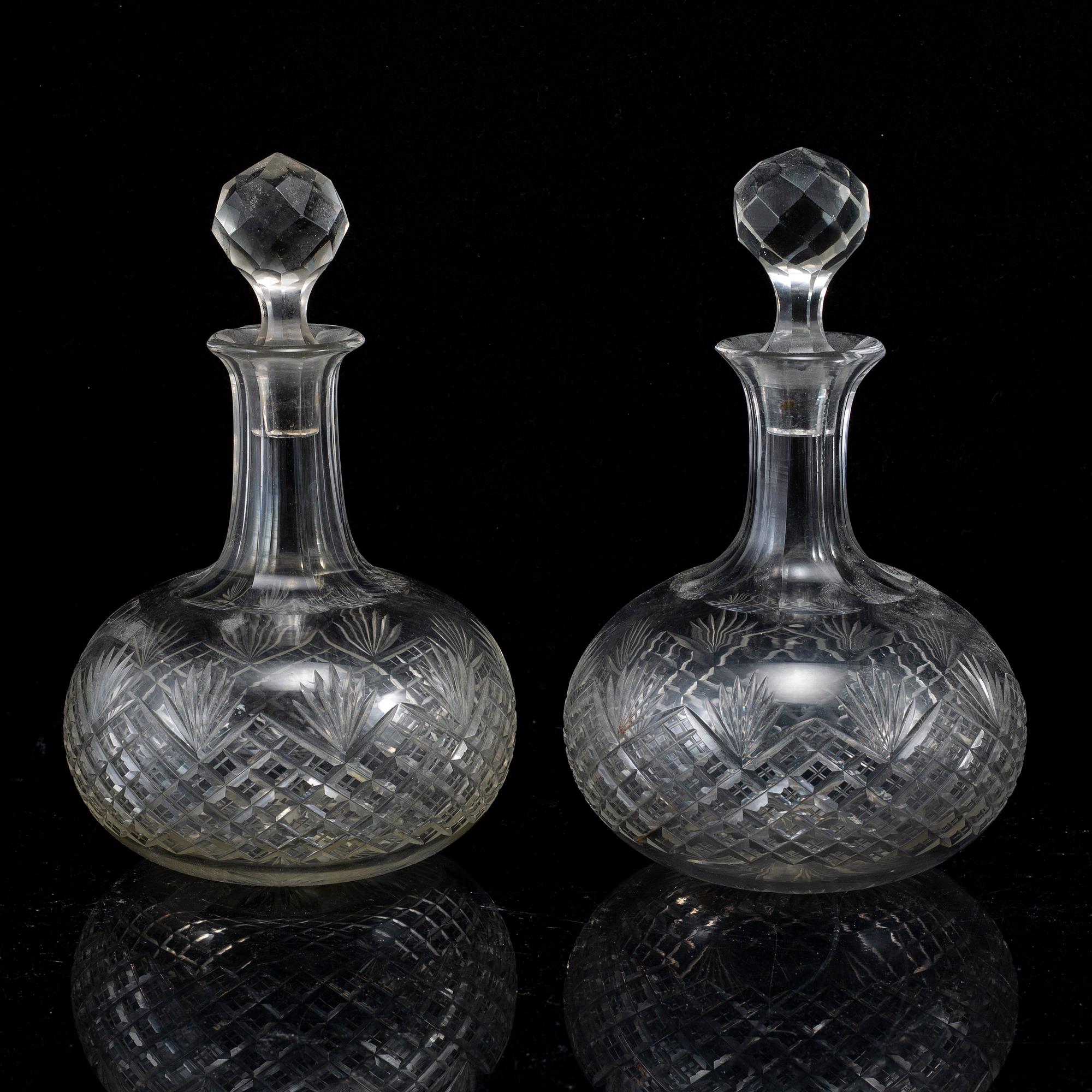 A set of four bottles with stoppers, 20th Century.