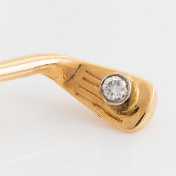 Slipsnål, 18K guld med briljantslipad diamant, i form av en golfklubba.