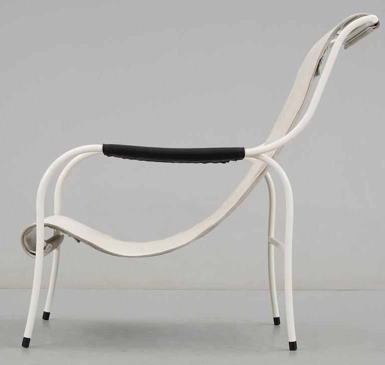 A Gustaf Isak Clason white lacquered and canvas easy chair by Källemo 2008.