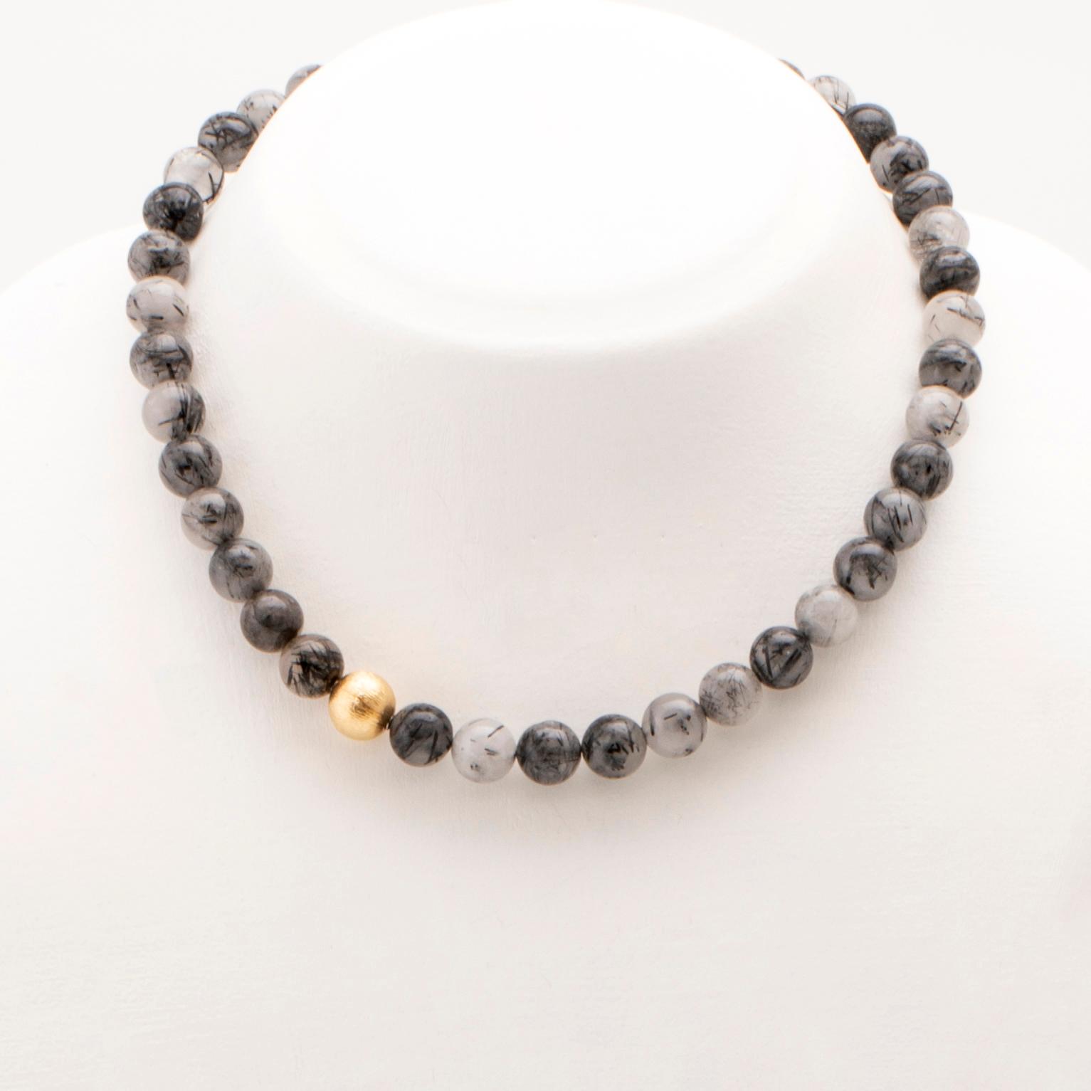 Ole Lynggaard, two necklaces and clasp in 18K gold.