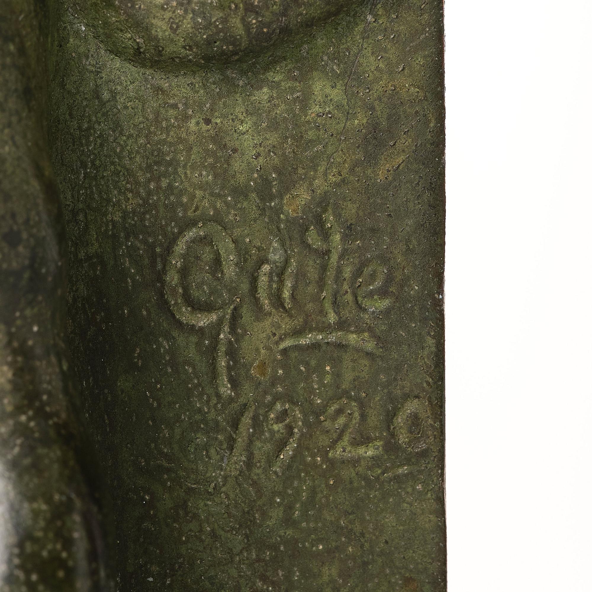 Axel Gute, a pair of green patinated metal bookends, Sweden, dated 1920.