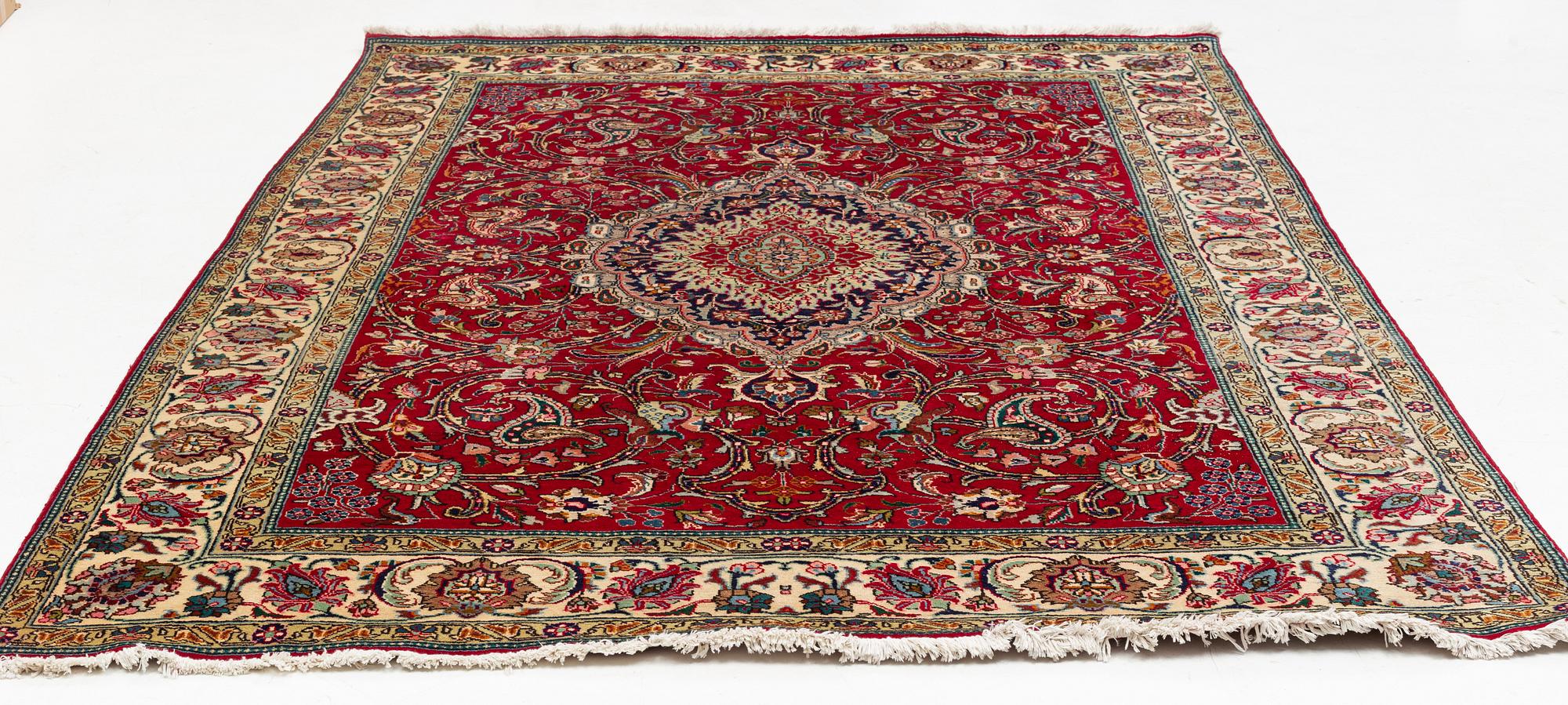 A Tabriz Carpet, circa 316 x 220 cm.