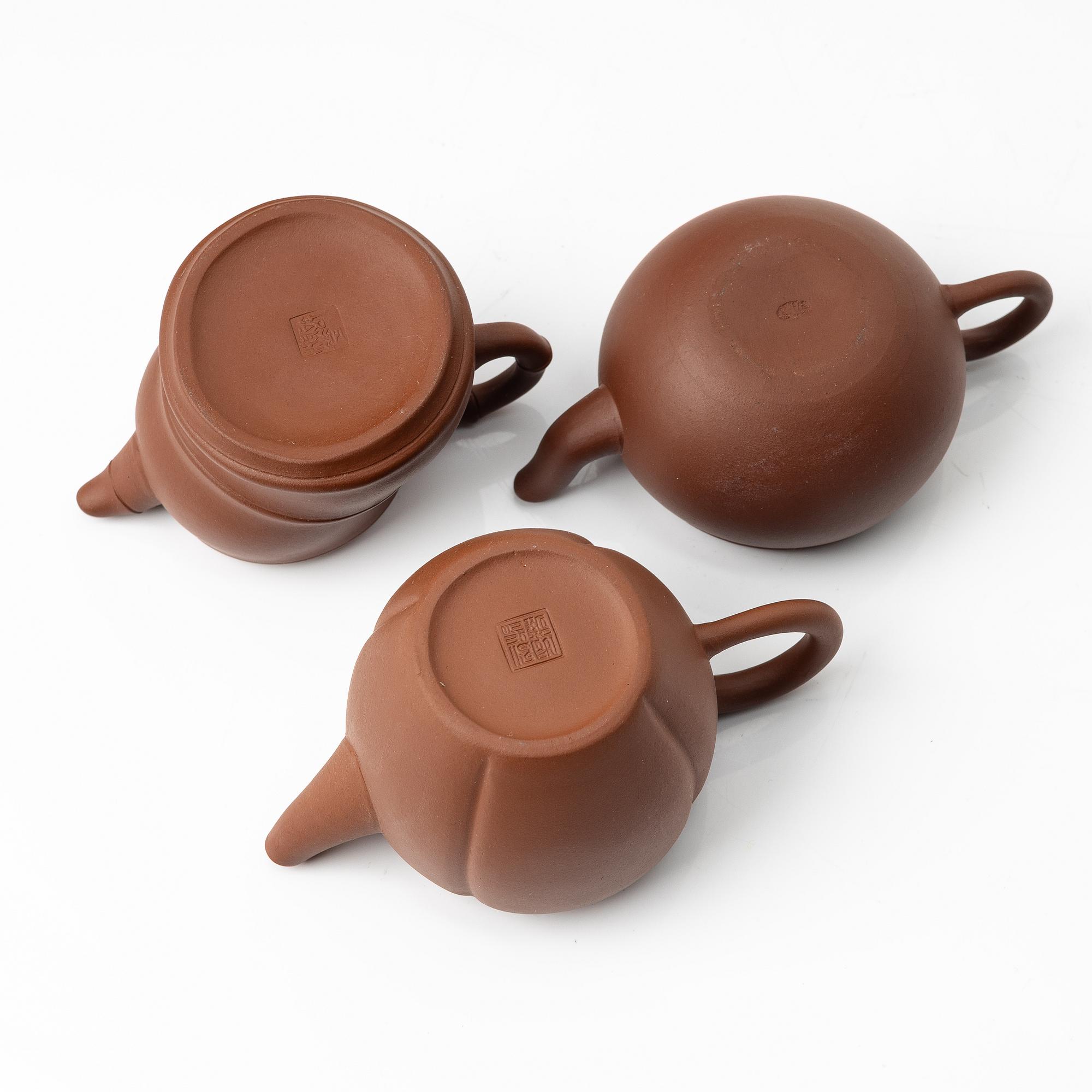 A group of three yixing 'gongfu' teapots, China, 1980s.