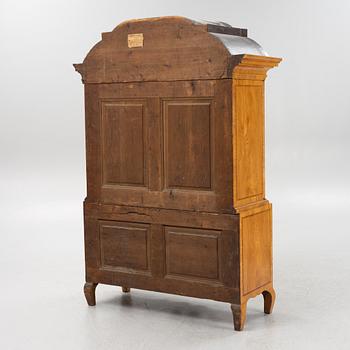 An oak veneered rococo cabinet, mid 18th Century.