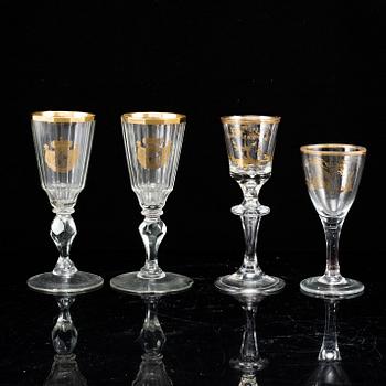 A set of four odd glasses, early 19th Century.