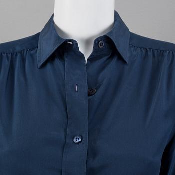 A navyblue silk blouse by Cèline.