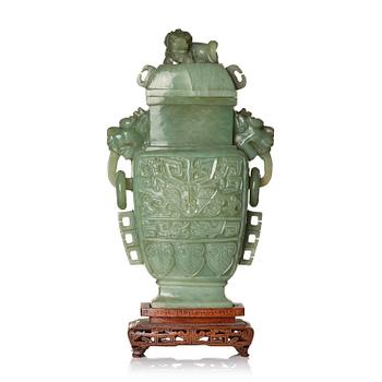 992. A Chinese archaistic bowenite vase with cover, Republic/20th century.