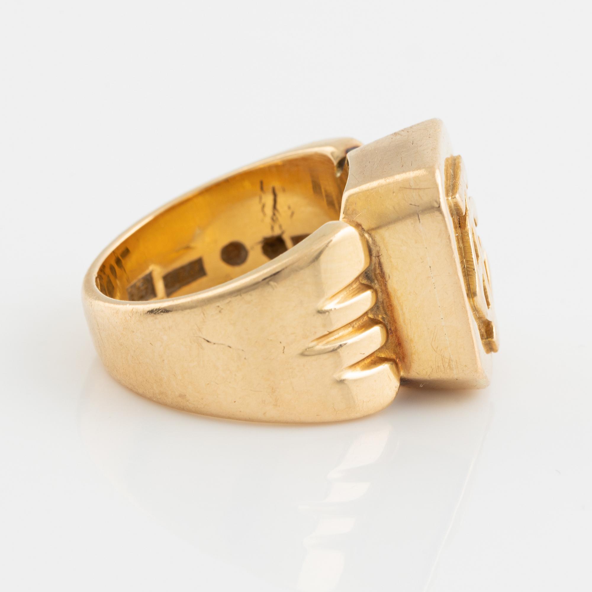 18K gold monograme ring.