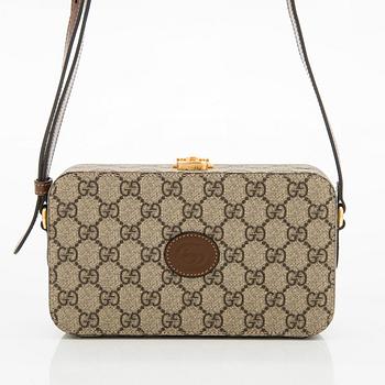 Gucci, A 'GG Supreme' bag.