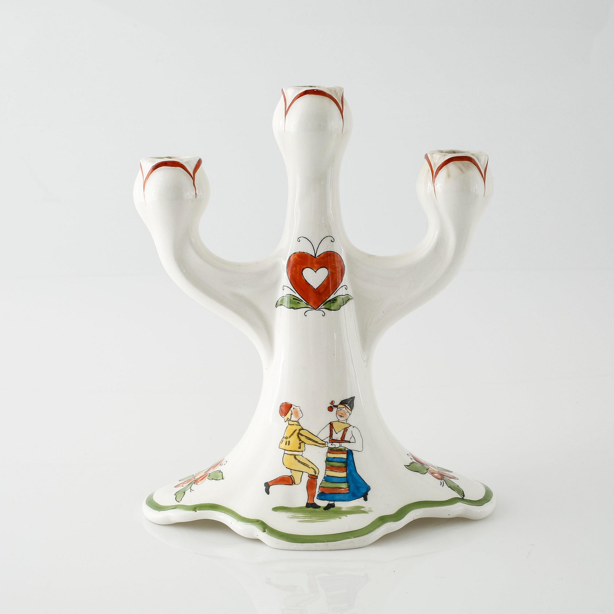 A candelabrum in ceramic named "Daldansen", Rörstrand, from early 20th century.