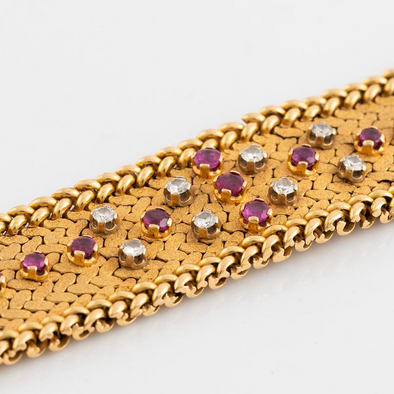 An 18K gold bracelet set with round brilliant-cut diamonds and rubies.