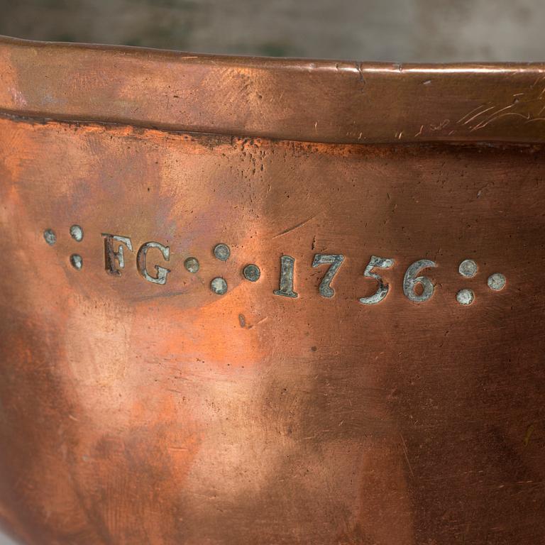 A copper saucepan marked FG 1756.