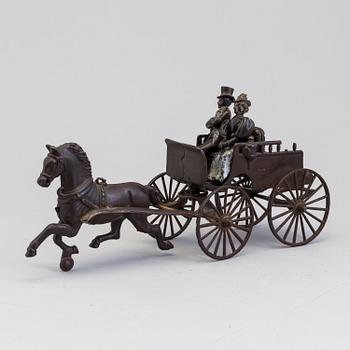 a cast iron horse-drawn carriage, USA, early 20th century.