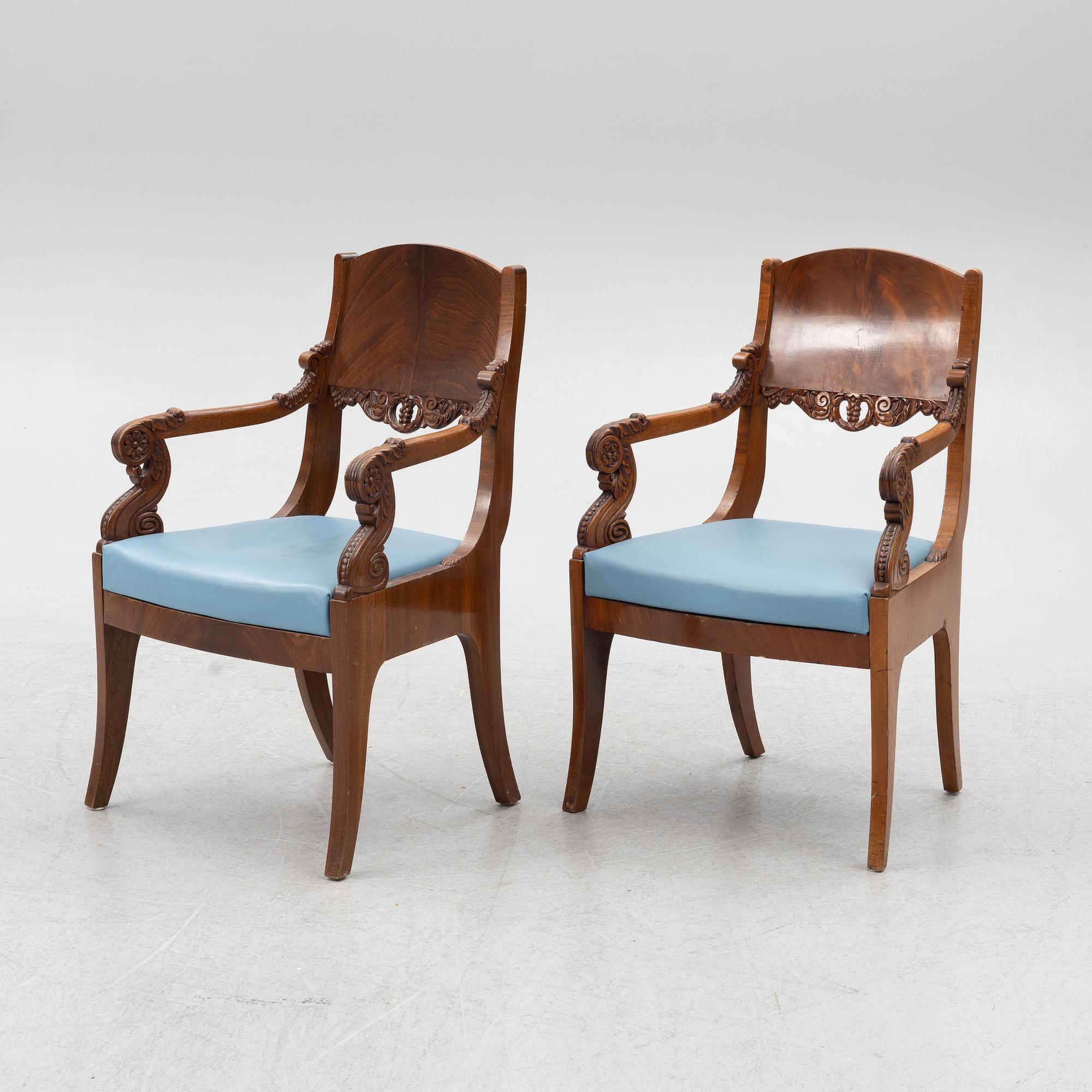 A pair of Baltic late Empire mahogany open armchairs, ca 1840.