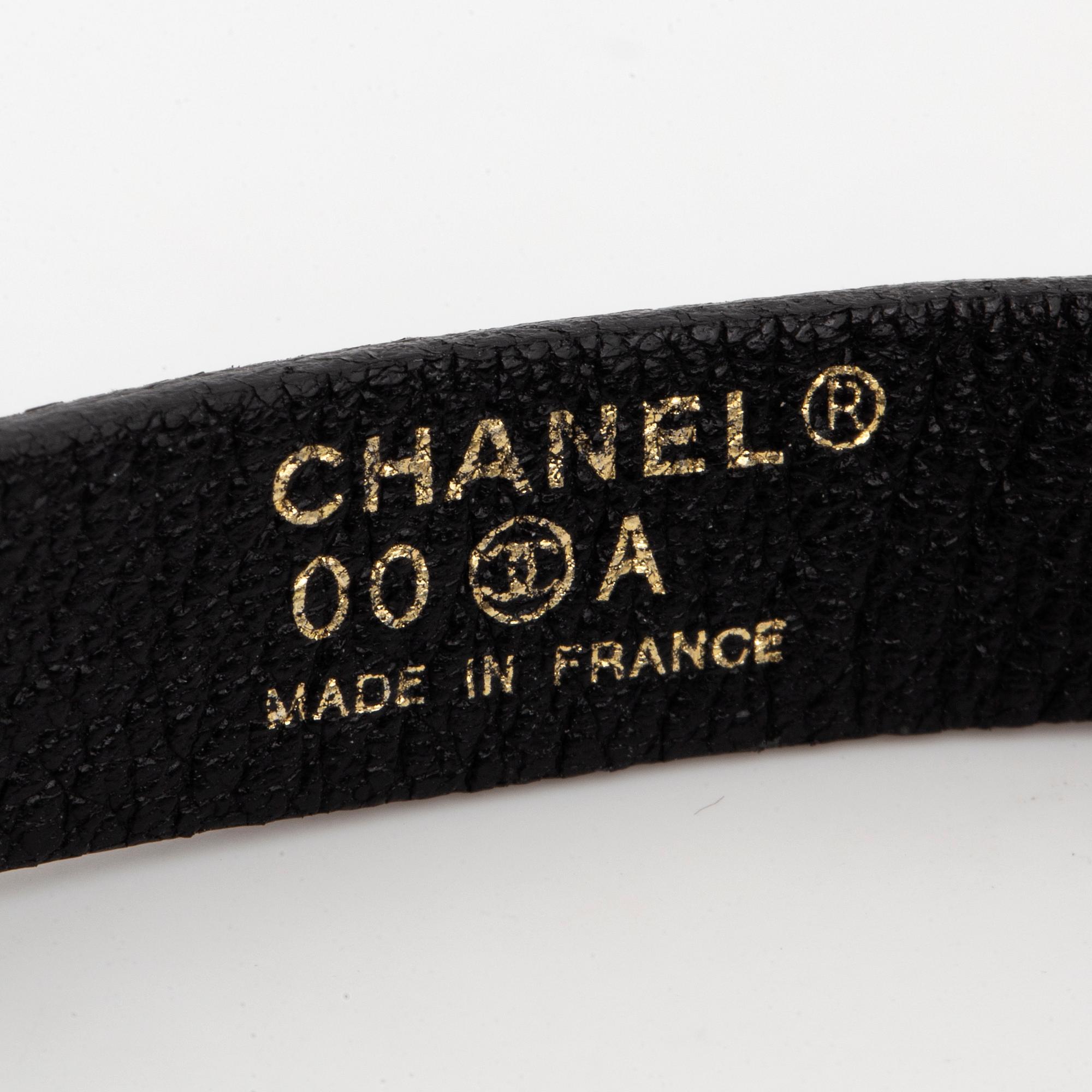 CHANEL, a leather bracelet.