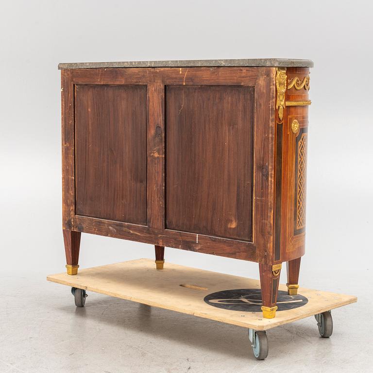 A Gustavian style cabinet with a stone top, 20th century.