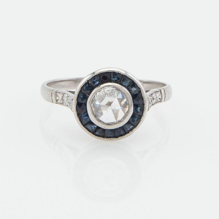 Halo ring, platinum with rose-cut diamond and sapphires.