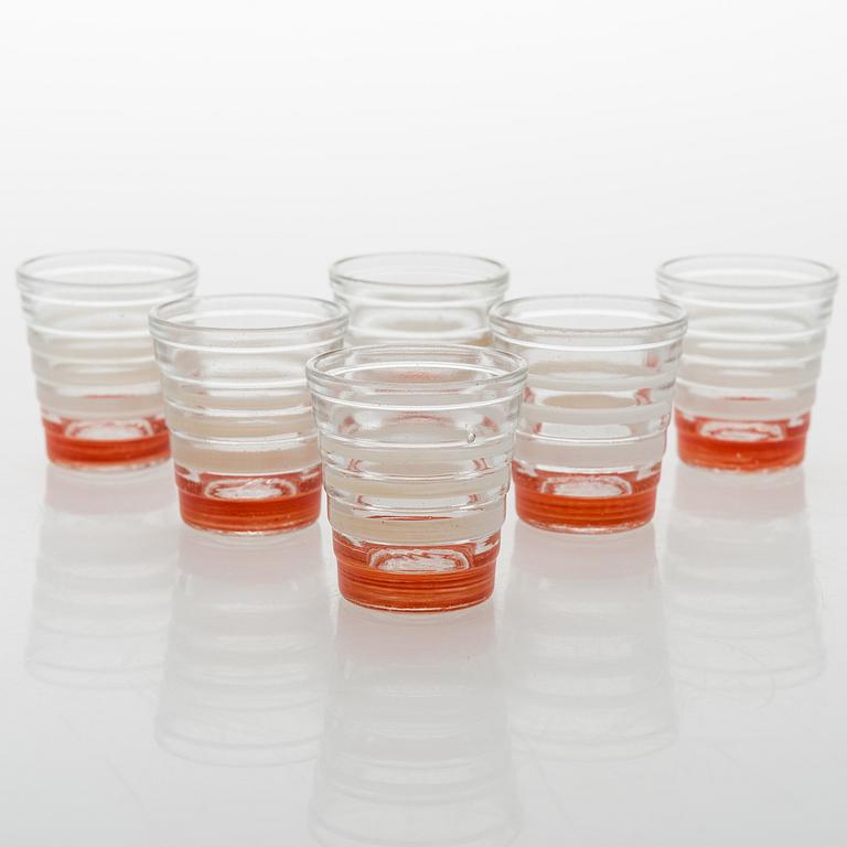 A set of 6 snapsglasses and a bottle designed by Aino Aalto for Karhula in the 1930-1940's.