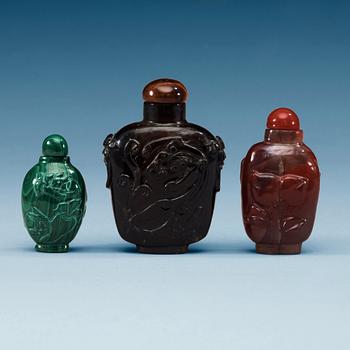 1449. A set of three Chinese snuff bottles.
