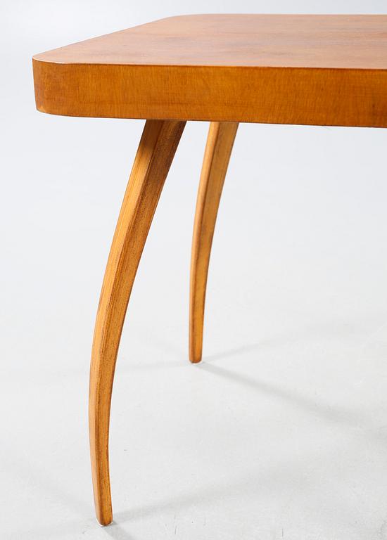 A table and a arm chair from the second quarter of the 20th century.