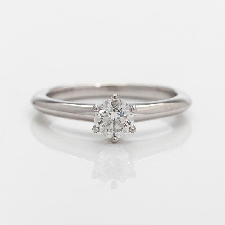 Tiffany & Co, a platinum solitaire ring with a brilliant-cut diamond.