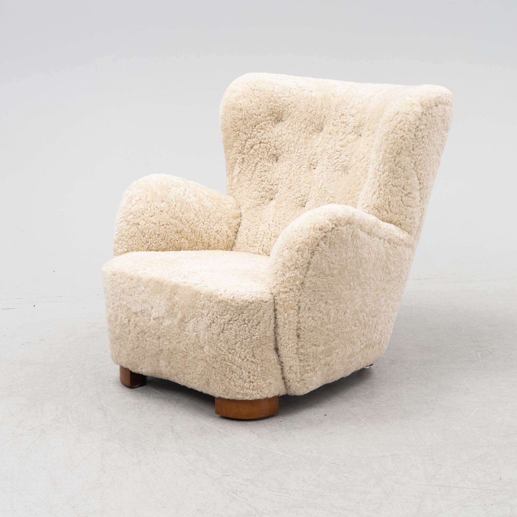 A lounge chair with new sheepskin upholstery, Denmark, 1940's.