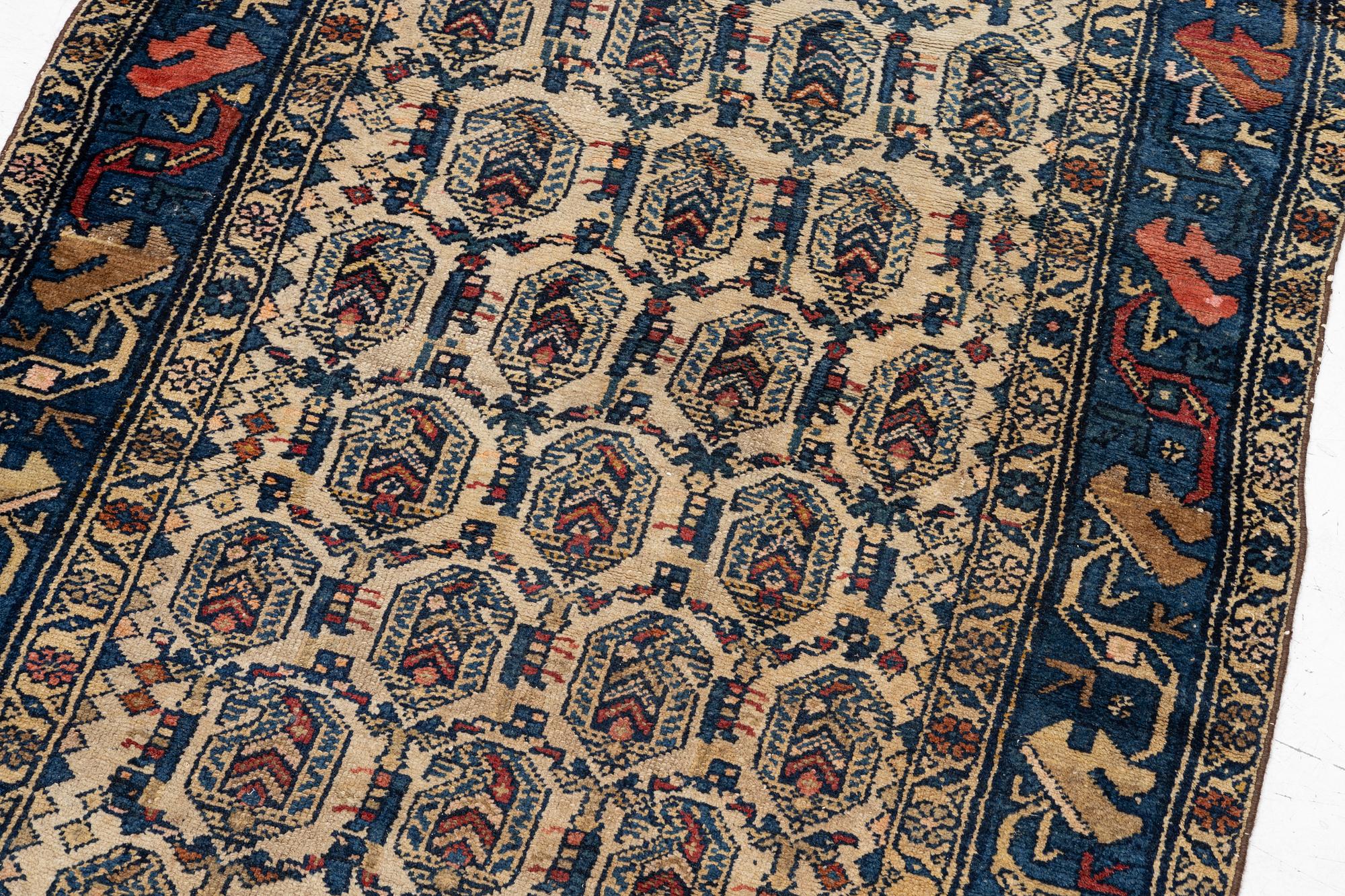 An antique Hamadan rug, c. 188 x 114 cm.