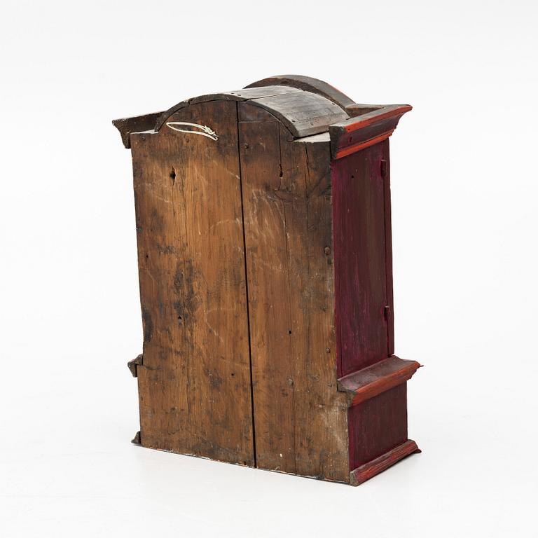 A 18th century Swedish wall-hanged cabinet.