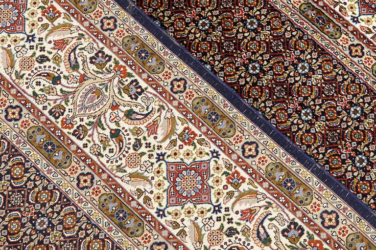 A Moud part silk carpet, signed, 335 x 250 cm.