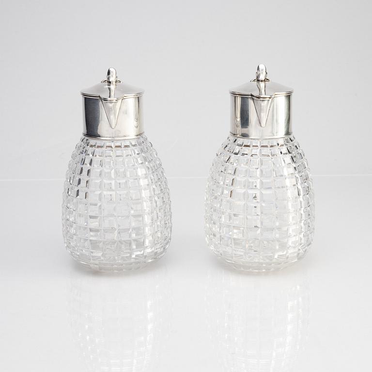 A pair of parcel-gilt silver and "hobnail" crystal decanters, W.A. Bolin, Stockholm 1920.