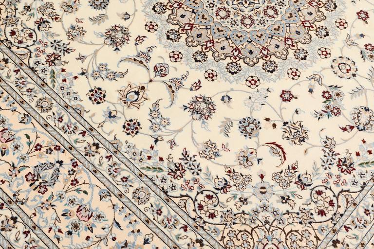 A Nain part silk carpet, c. 207 x 208 cm.