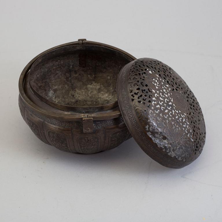 A Chinese engraved bronze hand warmer, late Qing dynasty,