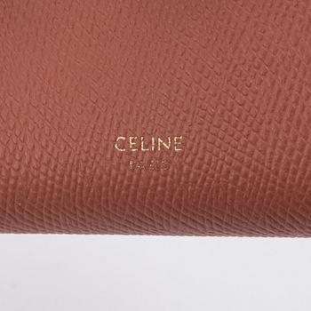 Céline, a two-tone calfskin 'Medium Strap Wallet', 2020.