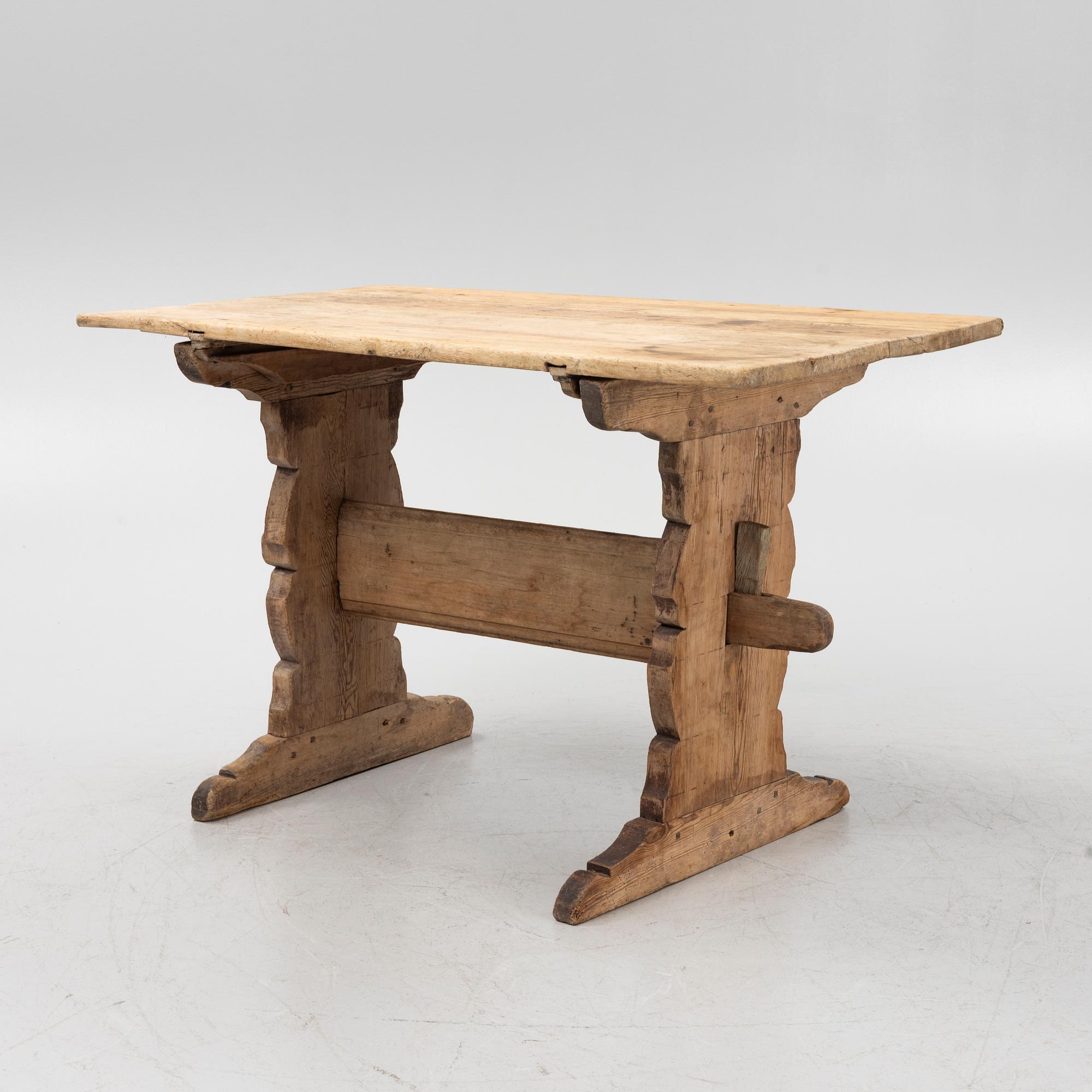 A pine trestle table, 19th century.