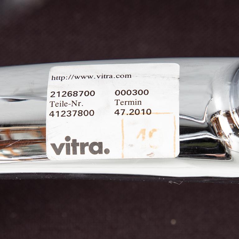 An EA 208 Soft Pad swivel chair by Charles and Ray Eames for Vitra, dated 2010.