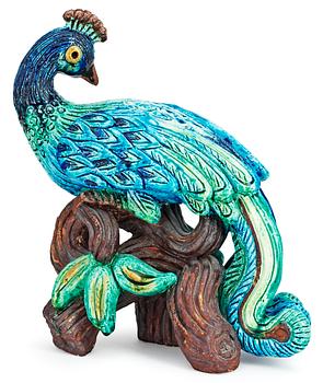 A Gunnar Nylund stoneware figure of a peacock.