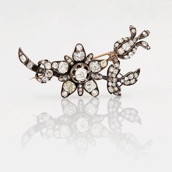 A BROOCH set with old-cut diamonds.
