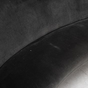 A curved sofa with velvet covering, 20th Century,