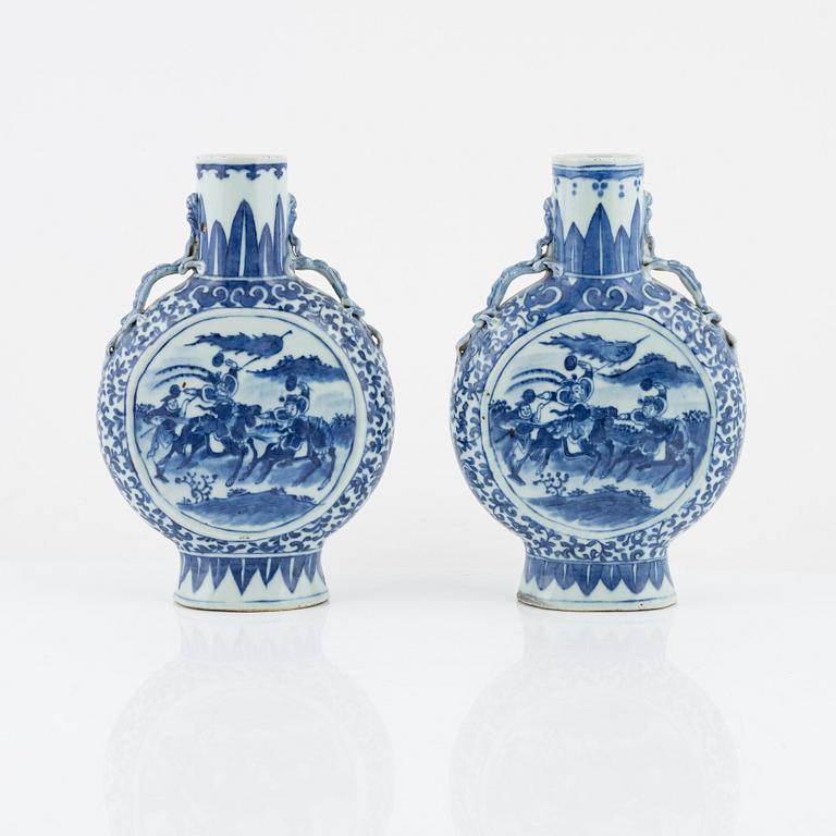 A matched pair of blue and white moon flasks, Qing dynasty, late 19th century.