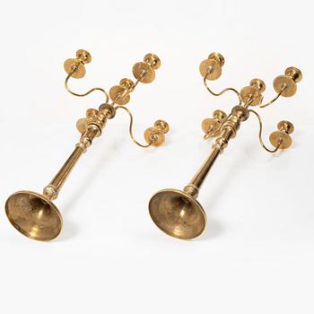 A pair of brass candelabra, model N12, Nyköpings Bruk, Sweden, around 1900.