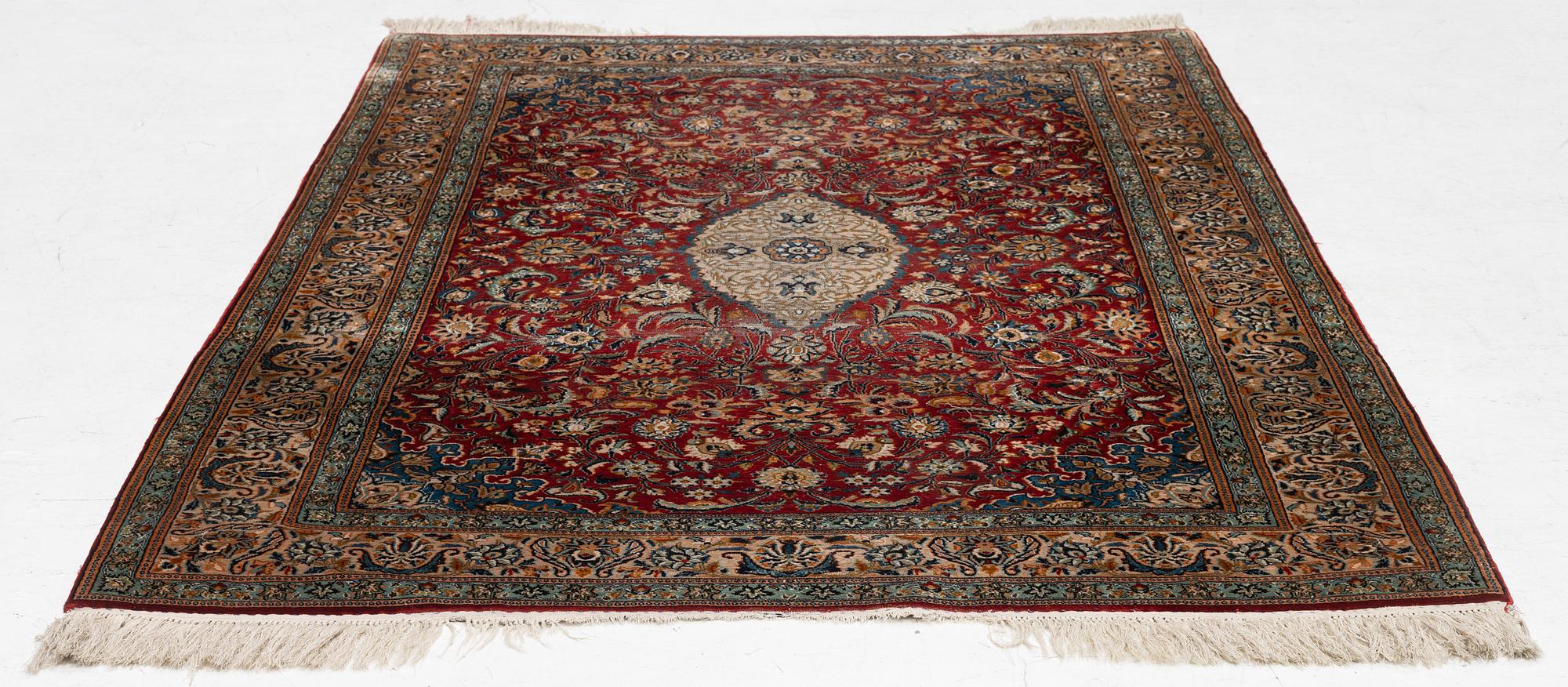 A silk Kashmir rug, c. 176 x 121 cm.